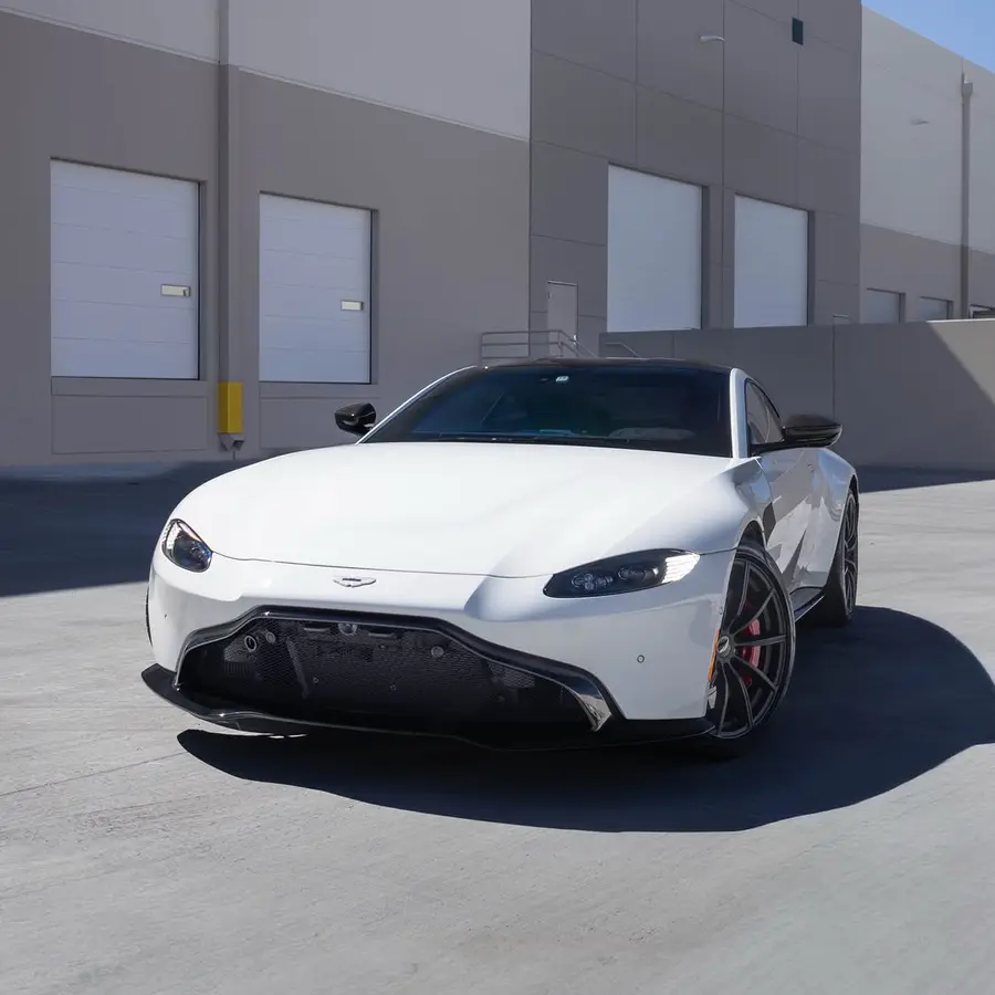 Lunar White over Pure Black Obsidian. A modern grand tourer shaped by British craftsmanship.